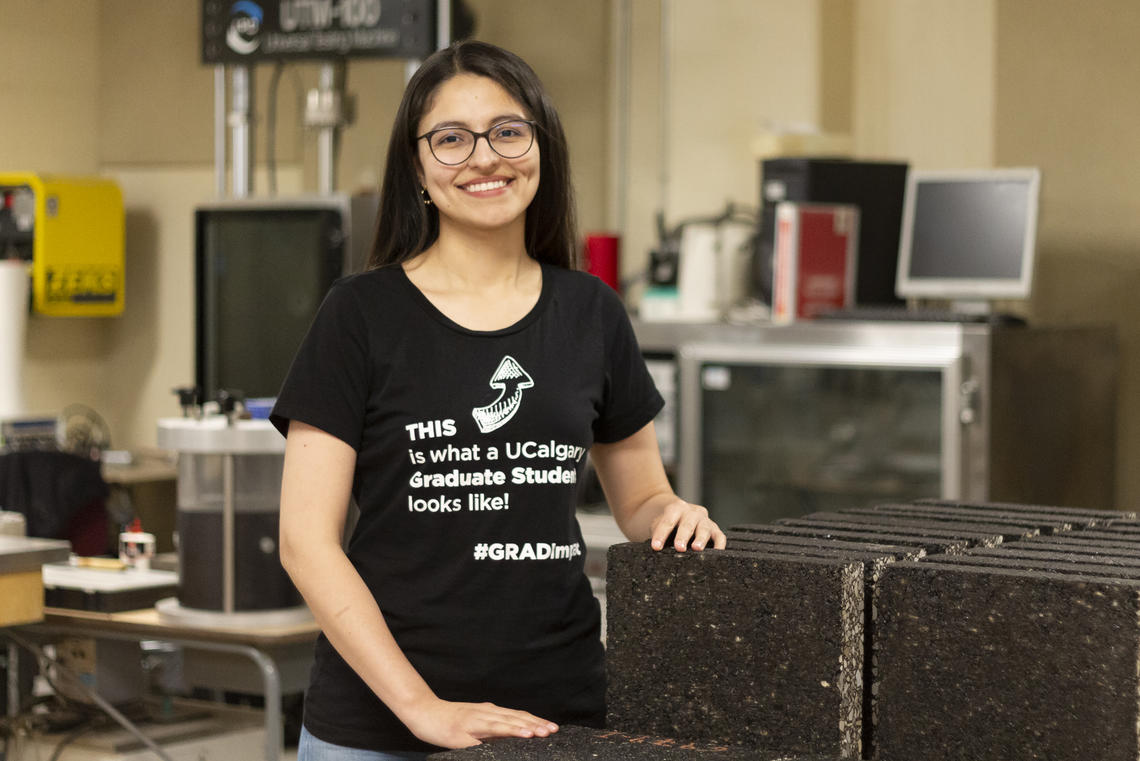 Chemical and petroleum engineering grad student Laura Rios Carreno examines asphalt samples.