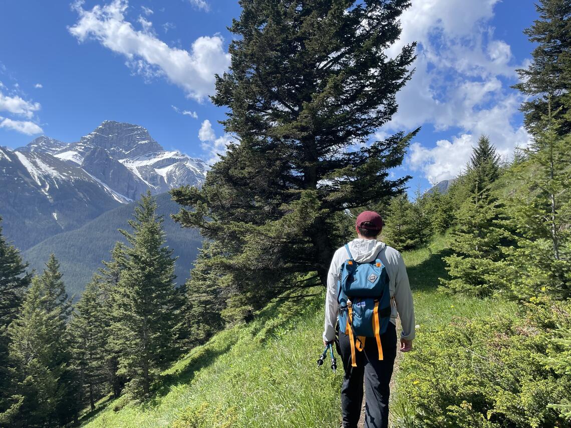 Picture of Taylor Kergan hiking in the mountains