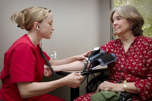 patient getting blood pressure taken