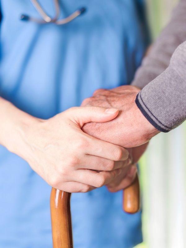 doctor holding patient's hand