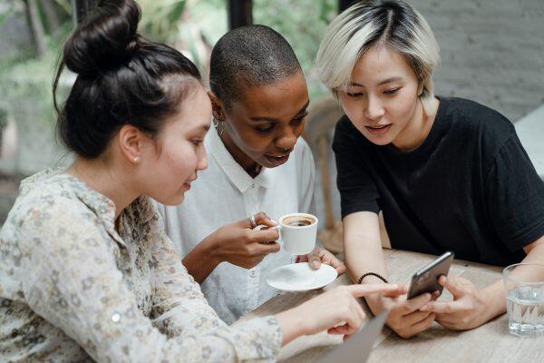 people looking at a smartphone