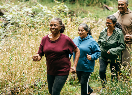 Four people walking outdoors