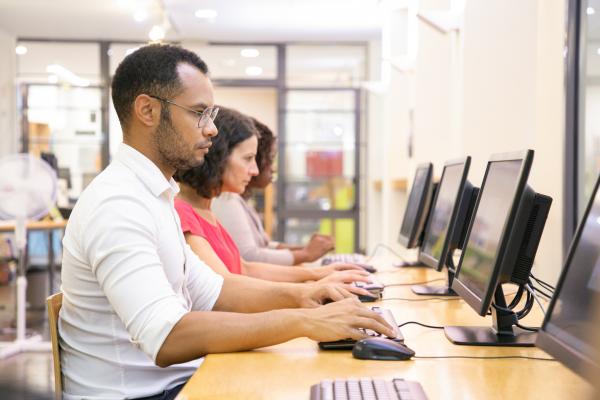 students on computers in a university setting