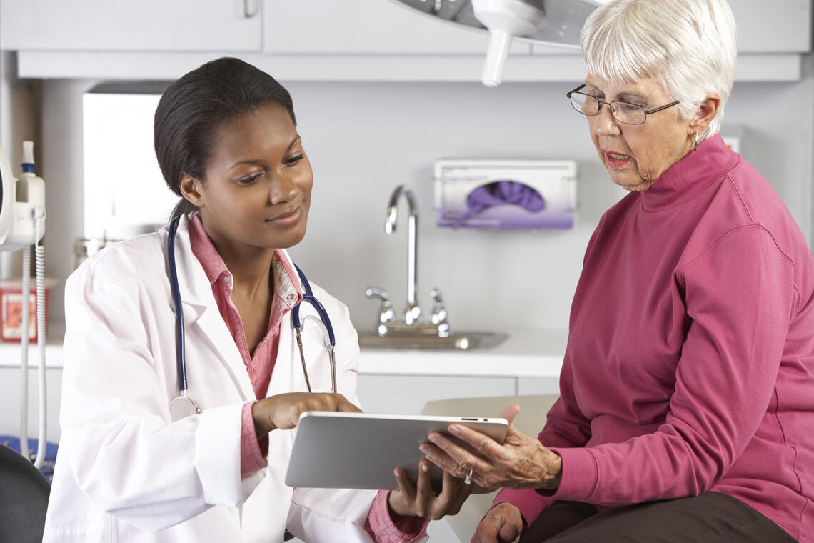 Doctor discussing records with a patient