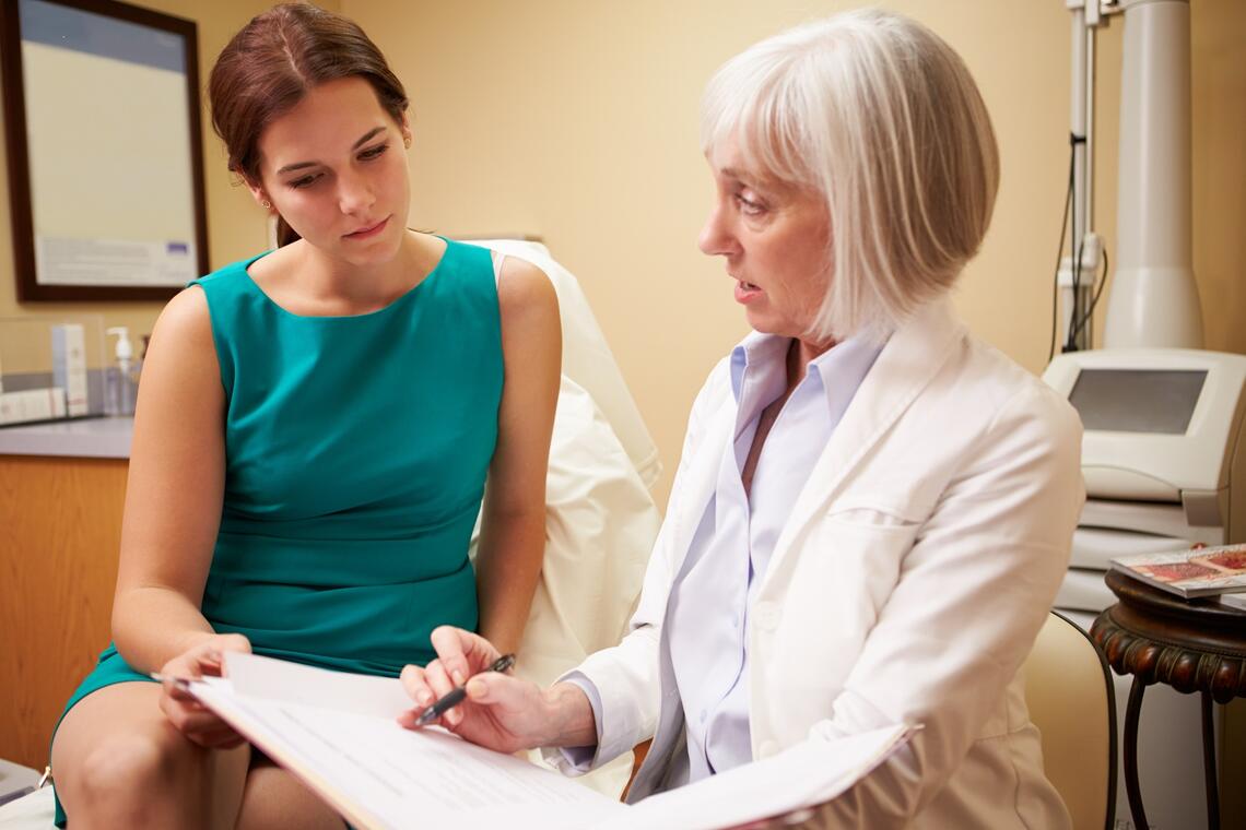 doctor speaks with patient