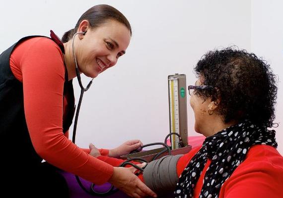 doctor taking a patient's blood pressure