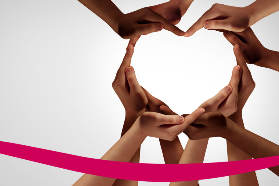 photo of several women placing their hands in the shape of a heart