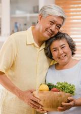 two seniors with a salad