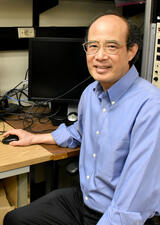 Dr. Wayne Chen sits in his lab