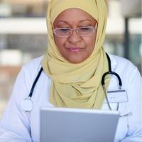 doctor reading off a tablet