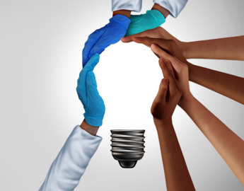 several human hands creating the shape of lightburb